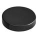 A black circular lid with a white background.