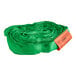 A green mesh roll with an orange and white tag containing a green Lift-All Tuflex roundsling.