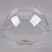 A clear plastic dome with a silver handle.