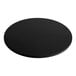 A black round Solwave pizza stone on a white table.