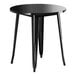 A Lancaster Table & Seating Onyx Black round table with metal legs.