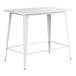 A white rectangular Lancaster Table & Seating bar height outdoor table with metal legs.