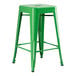 A Lancaster Table & Seating jade green metal backless counter height stool with legs and a seat.