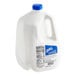 A white jug of Galliker's Fresh-to-Frozen Vanilla Soft Serve Ice Cream Mix with a blue cap.