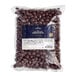 A white package of Capora milk chocolate covered espresso beans.