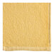 An Oxford yellow pool towel with a white border.