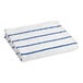 A folded white and blue striped Oxford pool towel.