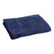 An Oxford navy blue pool towel on a white background.