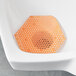 A urinal with a Fresh Products Wave 3D mango scented screen.