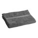 A folded grey Oxford Imperiale pool towel on a white background.