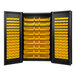 A black storage cabinet with yellow bins on the shelves.