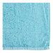 An aqua blue Oxford pool towel with a white background.