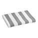 A grey and white striped Oxford Playa Cabana pool towel.