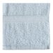 A close up of a light blue Oxford Imperiale pool towel with a white border.