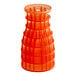 A stack of orange Fresh Products air freshener refills with red caps.