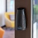 A black Fresh Products Eco-Air air freshener cabinet with a black button on it.