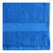 An Oxford blue pool towel with a stripe.