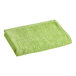 An apple green Oxford pool towel folded on a white background.