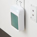 A white Ourfresh air freshener cabinet on a white wall.