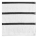 A close up of an Oxford charcoal gray and white striped pool towel.