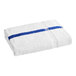 A white towel with blue stripes on it.