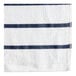 A navy blue towel with white stripes, including a white stripe with black lines.