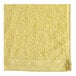 A yellow Oxford pool towel with white edges.