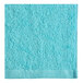 An aqua Oxford pool towel with a white border.