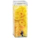 A Cal-Mil glass beverage dispenser with pineapple rings in it.