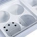 A white Avantco ice cream dipping cabinet with curved sneeze guard and two holes.