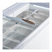 An Avantco gelato dipping cabinet with a flat glass lid and white containers inside.