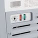 An Avantco ice cream dipping cabinet with a white and gray custom vinyl cover.