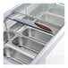 An Avantco gelato dipping cabinet with a glass door filled with silver trays.