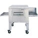 A large stainless steel Lincoln Impinger conveyor oven with wheels.