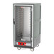 A large grey Metro C5 heated holding cabinet with clear glass doors and shelves.