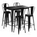 A Lancaster Table & Seating black metal bar height table with black edge and four black bar stools.