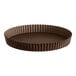 A brown Gobel round fluted tart/quiche pan with a removable bottom.