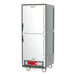 A grey Metro C5 heated holding cabinet with white solid doors.