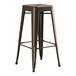 A brown metal stool with a wooden seat on a brown metal table.