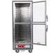A gray Metro C5 holding cabinet with clear Dutch doors open.