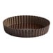 A brown round Gobel tart pan with a fluted edge and removable bottom.