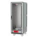 A large grey Metro C5 heated holding cabinet on wheels with shelves.