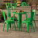 A Lancaster Table & Seating jade green table with chairs outside on a patio.