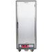 A gray Metro C5 heated holding cabinet with a solid door and a black handle on wheels.