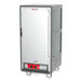 A grey and white Metro C5 heated holding cabinet with a solid door.