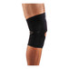 A person wearing a black Ergodyne ProFlex knee compression sleeve with an open patella and anterior pad.