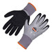 A pair of Ergodyne ProFlex work gloves with black mesh and orange silicone palms on a white background.