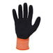 An orange and black Ergodyne ProFlex winter work glove with a sandy nitrile palm coating and an orange stripe.