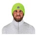 A man wearing a high visibility lime green rib knit winter hat.