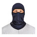 A man wearing a navy blue Ergodyne windproof fleece balaclava face mask.